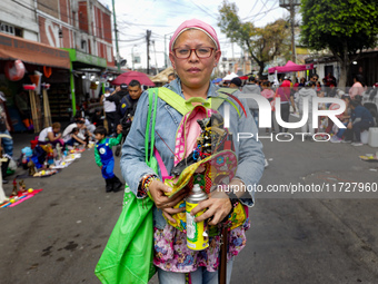 A devotee visits the altar of Santa Muerte located on Alfareria Street in the Tepito neighborhood to show their devotion and give thanks for...