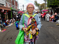 A devotee visits the altar of Santa Muerte located on Alfareria Street in the Tepito neighborhood to show their devotion and give thanks for...