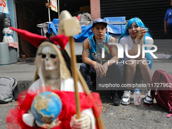 Devotees visit the Altar of Santa Muerte located on Alfareria Street in the Tepito neighborhood to show their devotion and give thanks for f...