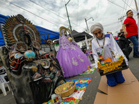 A devotee visits the Altar of Santa Muerte on his knees on Alfareria Street in the Tepito neighborhood to show devotion and give thanks for...