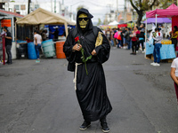 A devotee visits the altar of Santa Muerte located on Alfareria Street in the Tepito neighborhood to show their devotion and give thanks for...