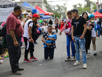 A devotee visits the Altar of Santa Muerte on his knees on Alfareria Street in the Tepito neighborhood to show devotion and give thanks for...