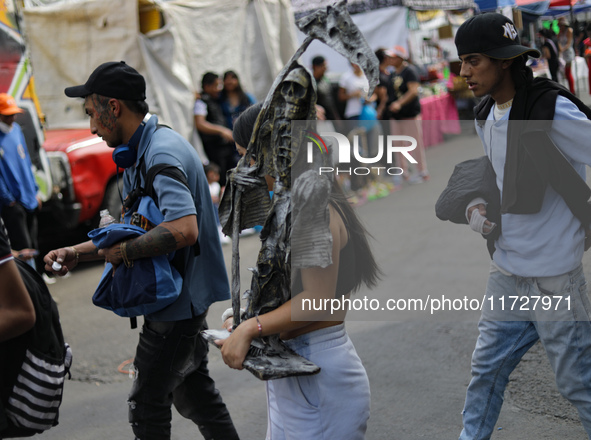 Devotees visit the Altar of Santa Muerte located on Alfareria Street in the Tepito neighborhood to show their devotion and give thanks for f...