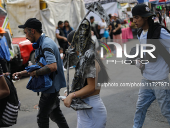 Devotees visit the Altar of Santa Muerte located on Alfareria Street in the Tepito neighborhood to show their devotion and give thanks for f...