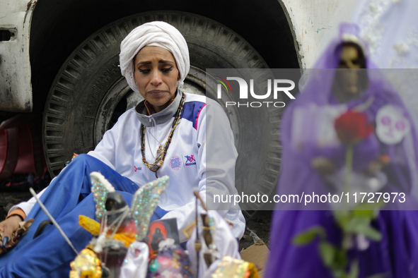 A devotee visits the altar of Santa Muerte located on Alfareria Street in the Tepito neighborhood to show their devotion and give thanks for...