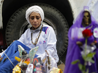 A devotee visits the altar of Santa Muerte located on Alfareria Street in the Tepito neighborhood to show their devotion and give thanks for...