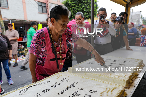 A devotee visits the altar of Santa Muerte located on Alfareria Street in the Tepito neighborhood to show their devotion and give thanks for...