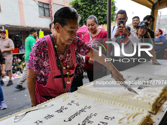 A devotee visits the altar of Santa Muerte located on Alfareria Street in the Tepito neighborhood to show their devotion and give thanks for...