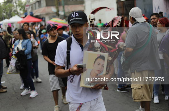 A devotee visits the altar of Santa Muerte located on Alfareria Street in the Tepito neighborhood to show their devotion and give thanks for...