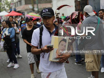 A devotee visits the altar of Santa Muerte located on Alfareria Street in the Tepito neighborhood to show their devotion and give thanks for...