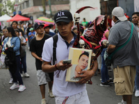 A devotee visits the altar of Santa Muerte located on Alfareria Street in the Tepito neighborhood to show their devotion and give thanks for...