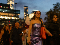 Costumed parade goers march during the 51st Annual Village Halloween Parade in New York, NY, on October 31, 2024. (