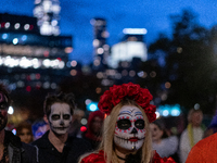 Costumed parade goers march during the 51st Annual Village Halloween Parade in New York, NY, on October 31, 2024. (