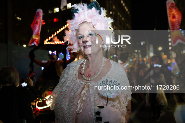 Costumed parade goers celebrate during the 51st Annual Village Halloween Parade in New York, NY, on October 31, 2024. 