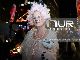 Costumed parade goers celebrate during the 51st Annual Village Halloween Parade in New York, NY, on October 31, 2024. (