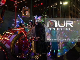 Costumed parade goers celebrate during the 51st Annual Village Halloween Parade in New York, NY, on October 31, 2024. (