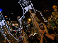 Costumed parade goers celebrate during the 51st Annual Village Halloween Parade in New York, NY, on October 31, 2024. (