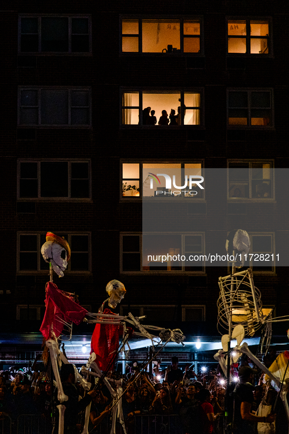 Costumed parade goers celebrate during the 51st Annual Village Halloween Parade in New York, NY, on October 31, 2024. 