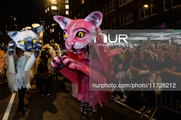 Costumed parade goers celebrate during the 51st Annual Village Halloween Parade in New York, NY, on October 31, 2024. 