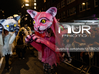 Costumed parade goers celebrate during the 51st Annual Village Halloween Parade in New York, NY, on October 31, 2024. (