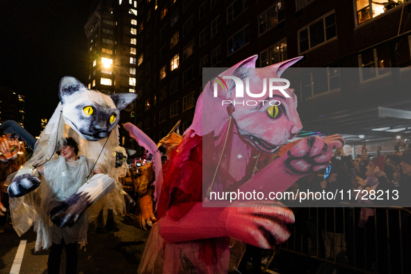 Costumed parade goers celebrate during the 51st Annual Village Halloween Parade in New York, NY, on October 31, 2024. 