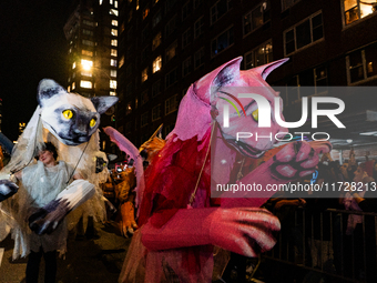 Costumed parade goers celebrate during the 51st Annual Village Halloween Parade in New York, NY, on October 31, 2024. (