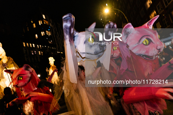 Costumed parade goers celebrate during the 51st Annual Village Halloween Parade in New York, NY, on October 31, 2024. 