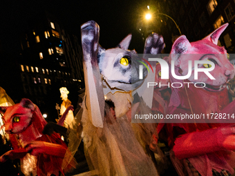 Costumed parade goers celebrate during the 51st Annual Village Halloween Parade in New York, NY, on October 31, 2024. (