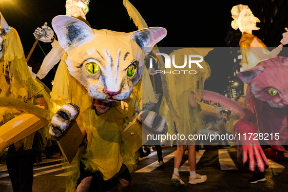 Costumed parade goers celebrate during the 51st Annual Village Halloween Parade in New York, NY, on October 31, 2024. 