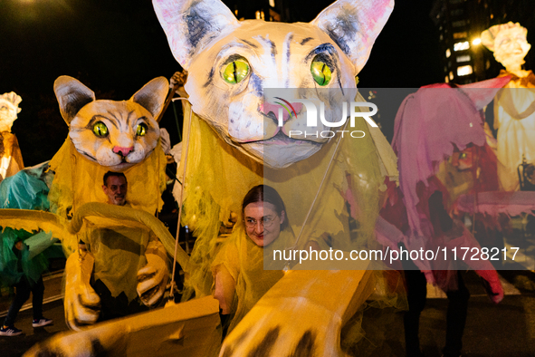 Costumed parade goers celebrate during the 51st Annual Village Halloween Parade in New York, NY, on October 31, 2024. 