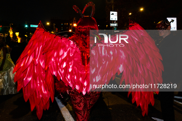 Costumed parade goers celebrate during the 51st Annual Village Halloween Parade in New York, NY, on October 31, 2024. 