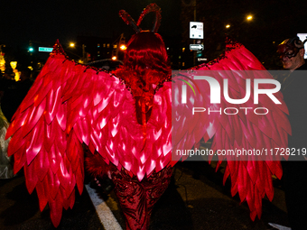 Costumed parade goers celebrate during the 51st Annual Village Halloween Parade in New York, NY, on October 31, 2024. (