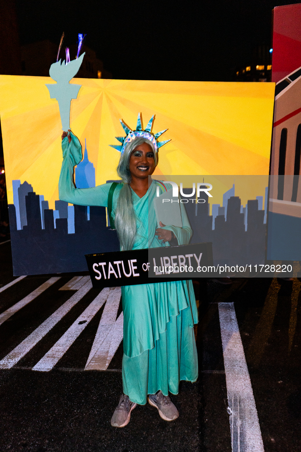 Costumed parade goers celebrate during the 51st Annual Village Halloween Parade in New York, NY, on October 31, 2024. 