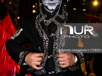 Costumed parade goers celebrate during the 51st Annual Village Halloween Parade in New York, NY, on October 31, 2024. (