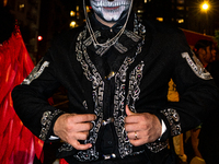 Costumed parade goers celebrate during the 51st Annual Village Halloween Parade in New York, NY, on October 31, 2024. (