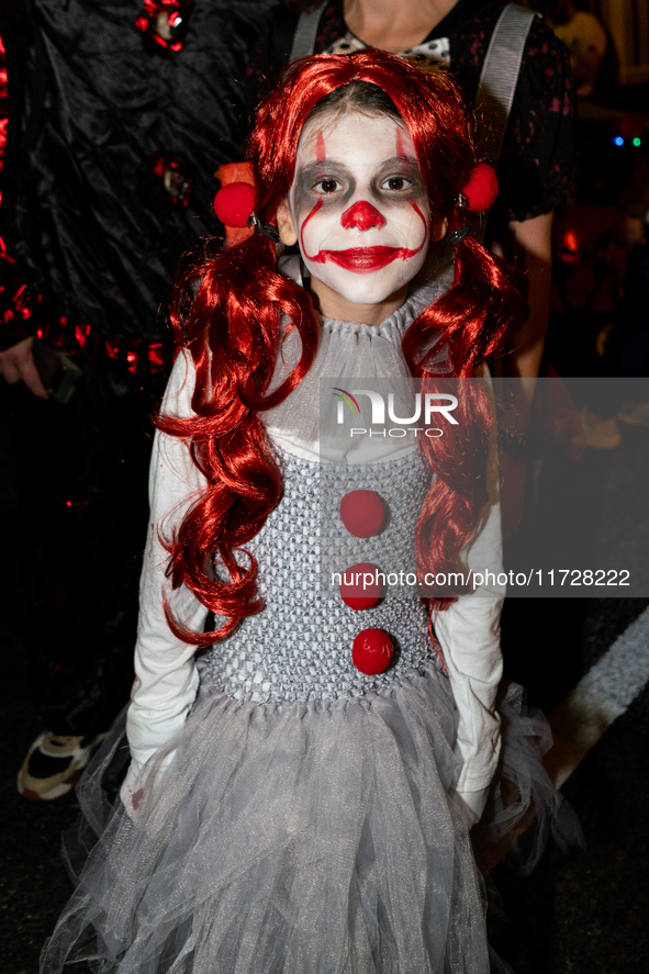 Costumed parade goers celebrate during the 51st Annual Village Halloween Parade in New York, NY, on October 31, 2024. 