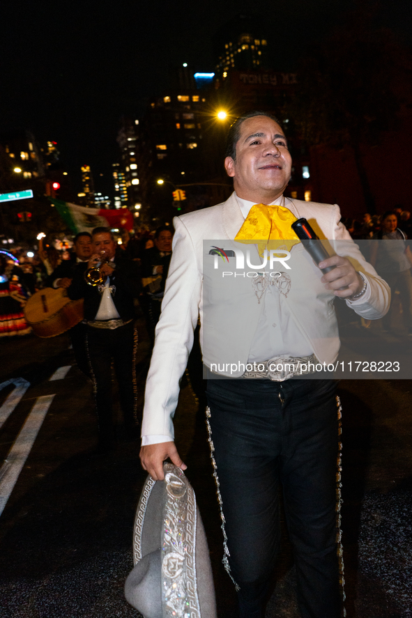 Costumed parade goers celebrate during the 51st Annual Village Halloween Parade in New York, NY, on October 31, 2024. 