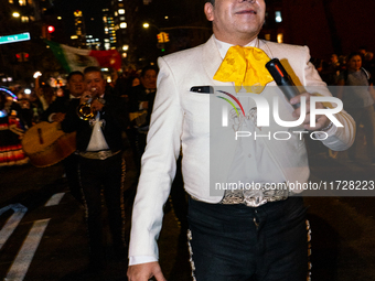 Costumed parade goers celebrate during the 51st Annual Village Halloween Parade in New York, NY, on October 31, 2024. (