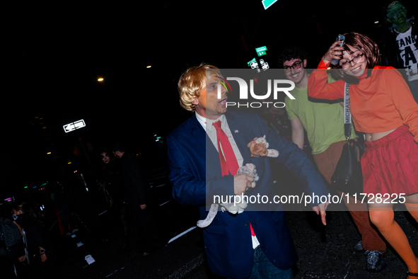 Costumed parade goers celebrate during the 51st Annual Village Halloween Parade in New York, NY, on October 31, 2024. 