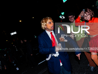 Costumed parade goers celebrate during the 51st Annual Village Halloween Parade in New York, NY, on October 31, 2024. (