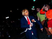 Costumed parade goers celebrate during the 51st Annual Village Halloween Parade in New York, NY, on October 31, 2024. (