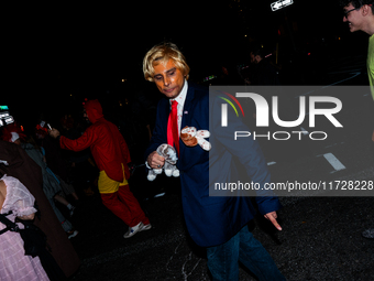 Costumed parade goers celebrate during the 51st Annual Village Halloween Parade in New York, NY, on October 31, 2024. (