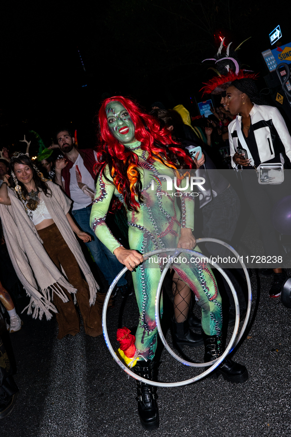 Costumed parade goers celebrate during the 51st Annual Village Halloween Parade in New York, NY, on October 31, 2024. 