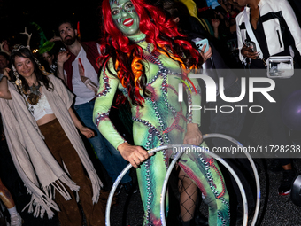 Costumed parade goers celebrate during the 51st Annual Village Halloween Parade in New York, NY, on October 31, 2024. (