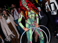 Costumed parade goers celebrate during the 51st Annual Village Halloween Parade in New York, NY, on October 31, 2024. (