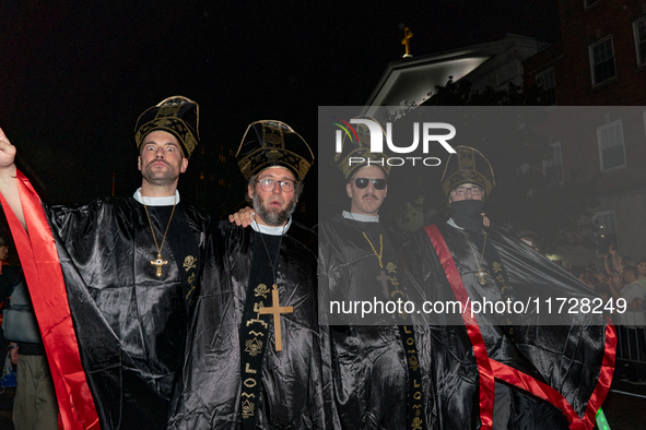 Costumed parade goers pose for a photo during the 51st Annual Village Halloween Parade in New York, NY, on October 31, 2024. 