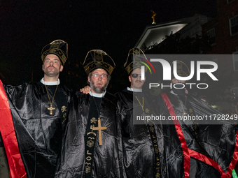 Costumed parade goers pose for a photo during the 51st Annual Village Halloween Parade in New York, NY, on October 31, 2024. (