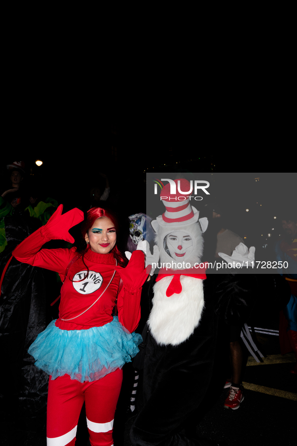 Costumed parade goers pose for a photo during the 51st Annual Village Halloween Parade in New York, NY, on October 31, 2024. 