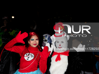 Costumed parade goers pose for a photo during the 51st Annual Village Halloween Parade in New York, NY, on October 31, 2024. (