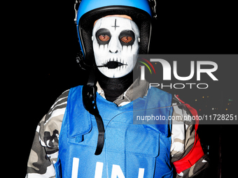 Costumed parade goers march during the 51st Annual Village Halloween Parade in New York, NY, on October 31, 2024. (